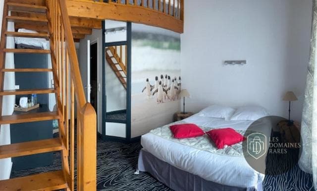 Chambre de l'hôtel Au Palmyre Hôtel à La en Nouvelle-Aquitaine