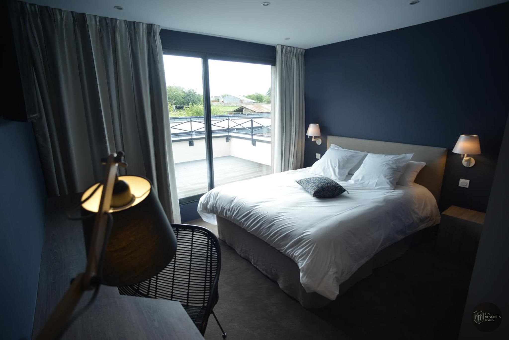 Chambre de l'auberge Auberge de la Hardouinais à Saint en Bretagne - séminaire saint-launeuc, france
