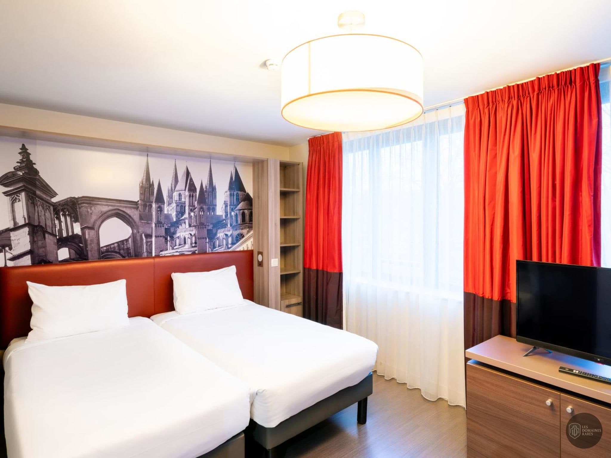 Chambre de l'hôtel BB Home Caen Centre Gare en Normandie