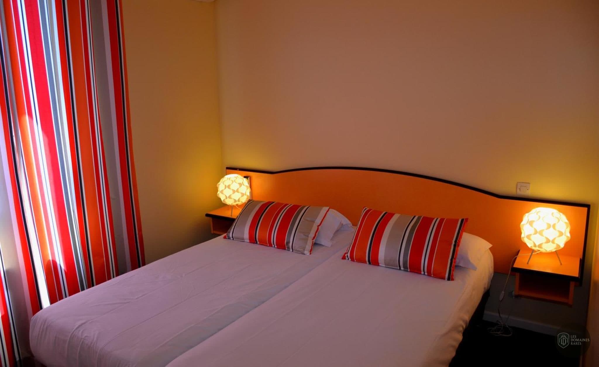 Chambre de l'hôtel Hôtel Arc en Ciel en Auvergne-Rhône-Alpes