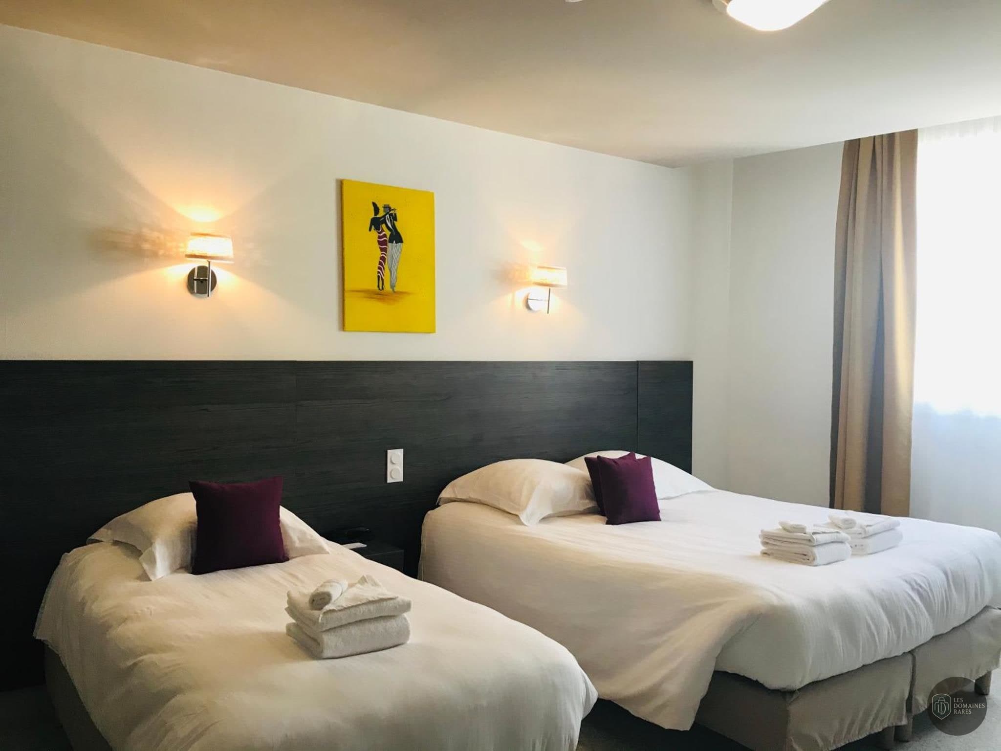 Chambre de l'hôtel Hôtel Le Chapon Fin à Moissac en Occitanie