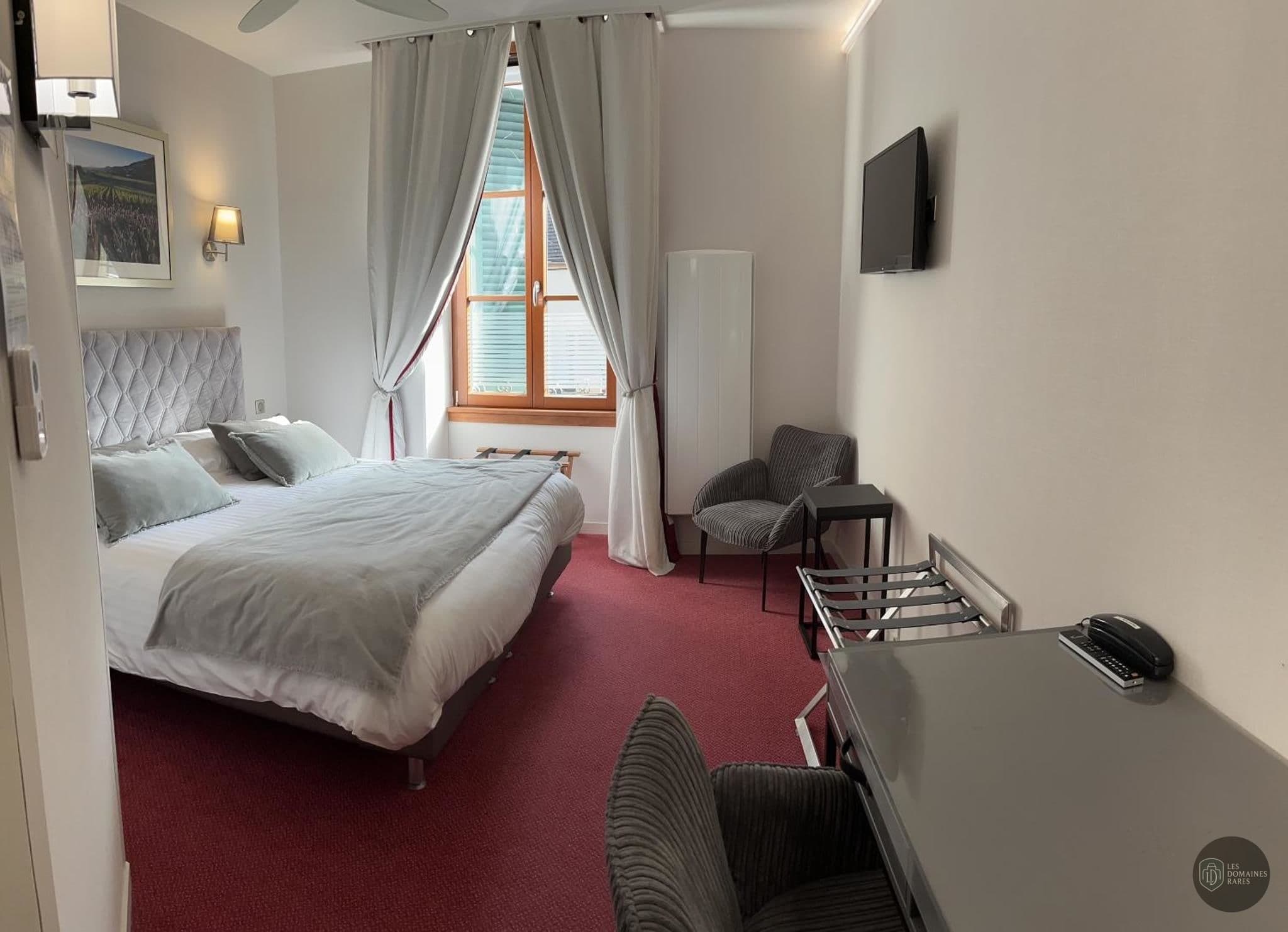 Chambre de l'hôtel Hôtel des Messageries à Saintes en Nouvelle-Aquitaine