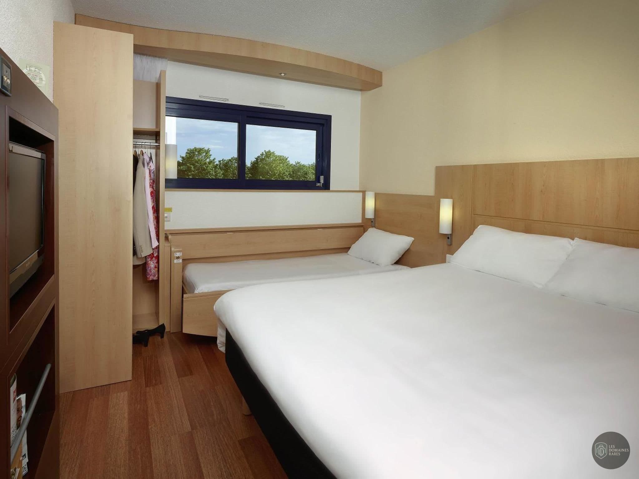 Chambre de l'hôtel Ibis Site du Futuroscope en Nouvelle-Aquitaine - séminaire vienne (86)