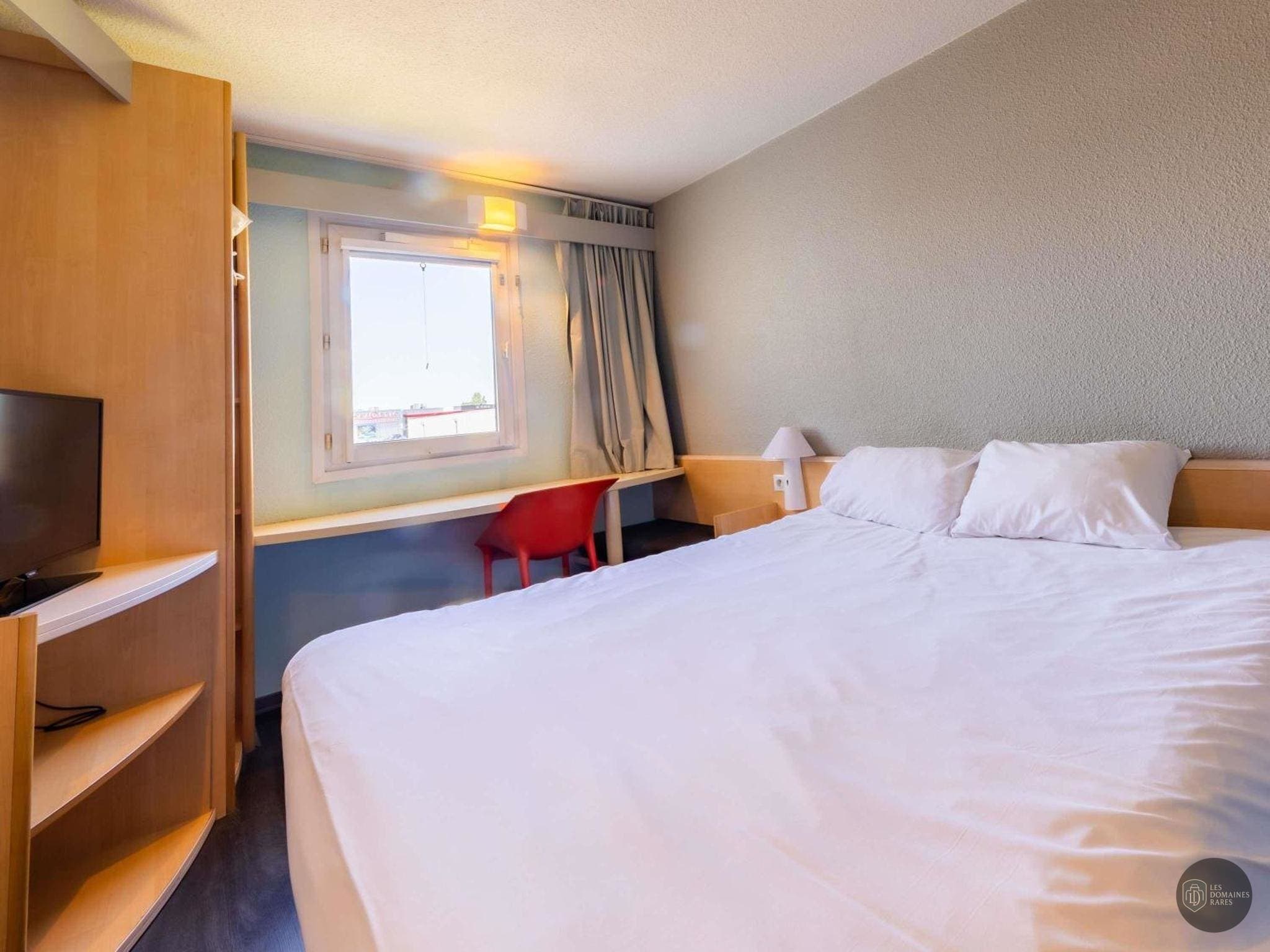 Chambre de l'hôtel Ibis Vesoul en Bourgogne-Franche-Comté