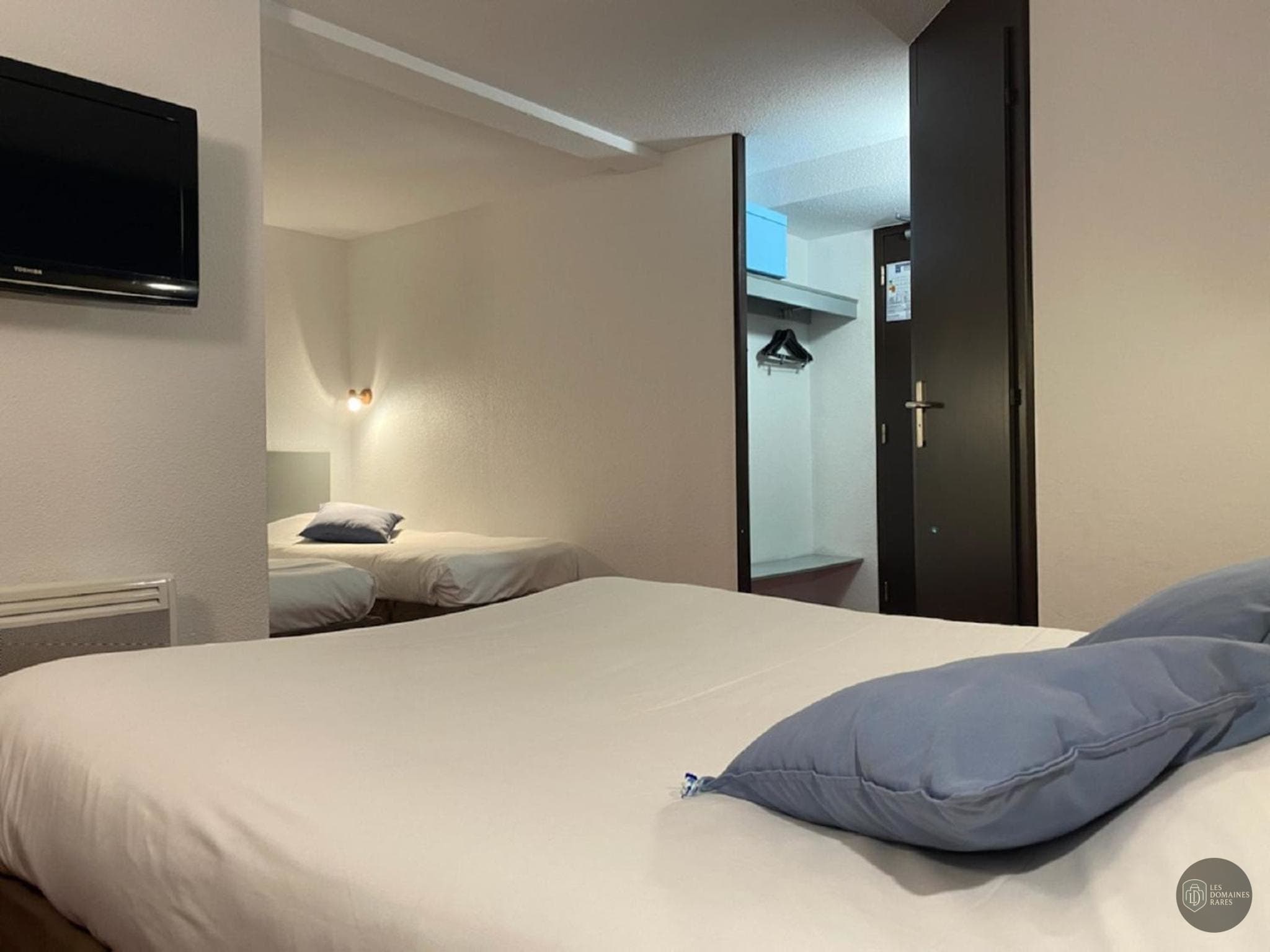 Chambre de l'hôtel Kyriad Design Enzo en Île-de-France