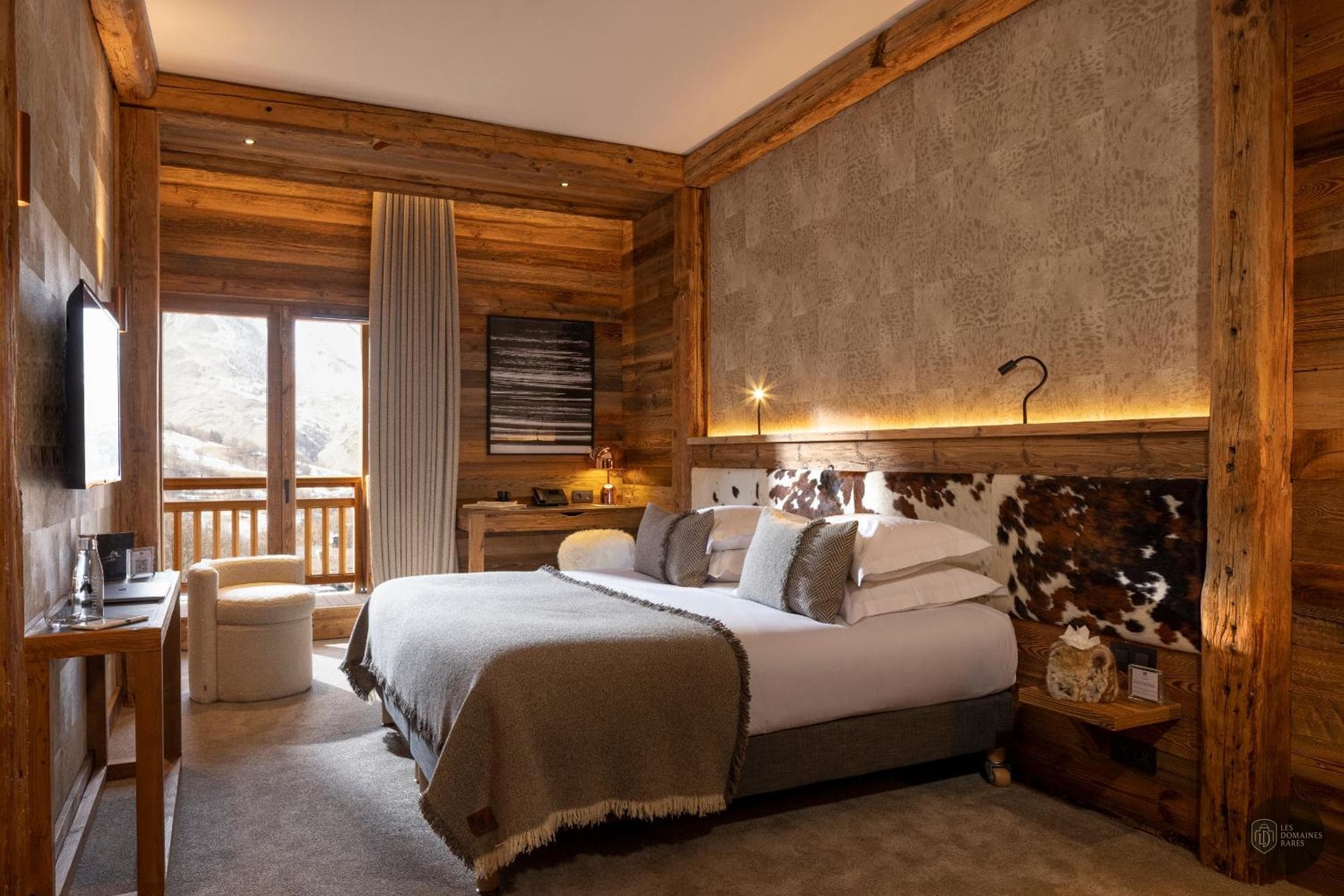 Chambre de l'hôtel M Lodge et Spa à Val en Auvergne-Rhône-Alpes - séminaire savoie