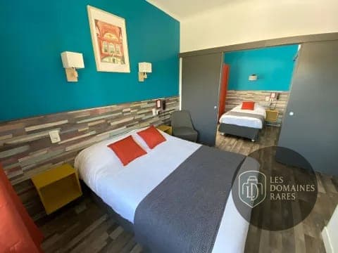 Chambre familiale avec deux lits